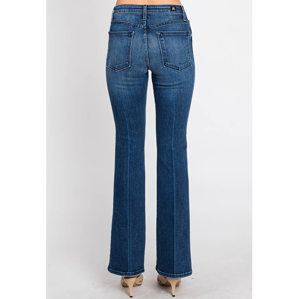 Woman wearing Bella Whisker Flare Denim in classic blue with a high-rise fit and wide leg silhouette from the back view.