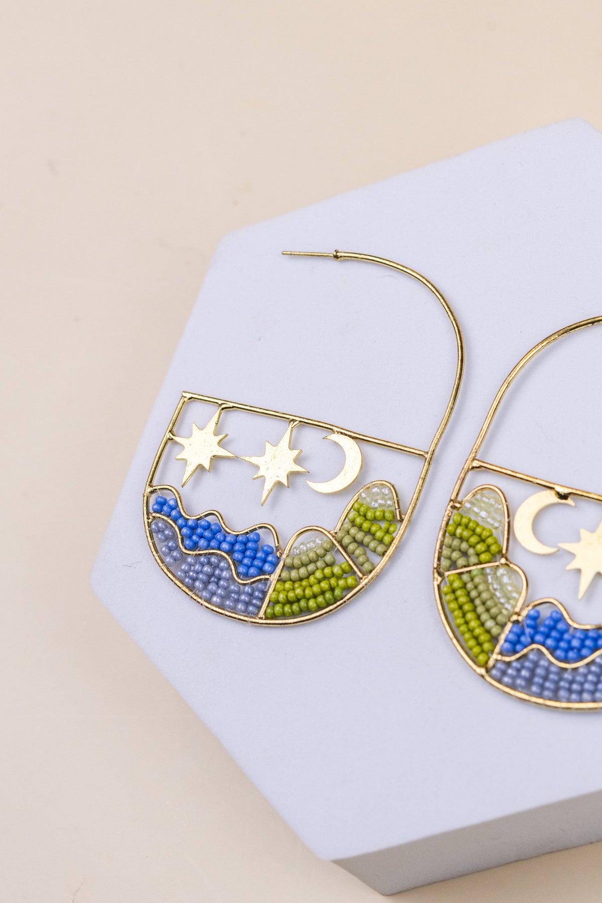 Brea Landscape Hoops artisan gold earrings with colorful blue waves green hills stars and crescent moons