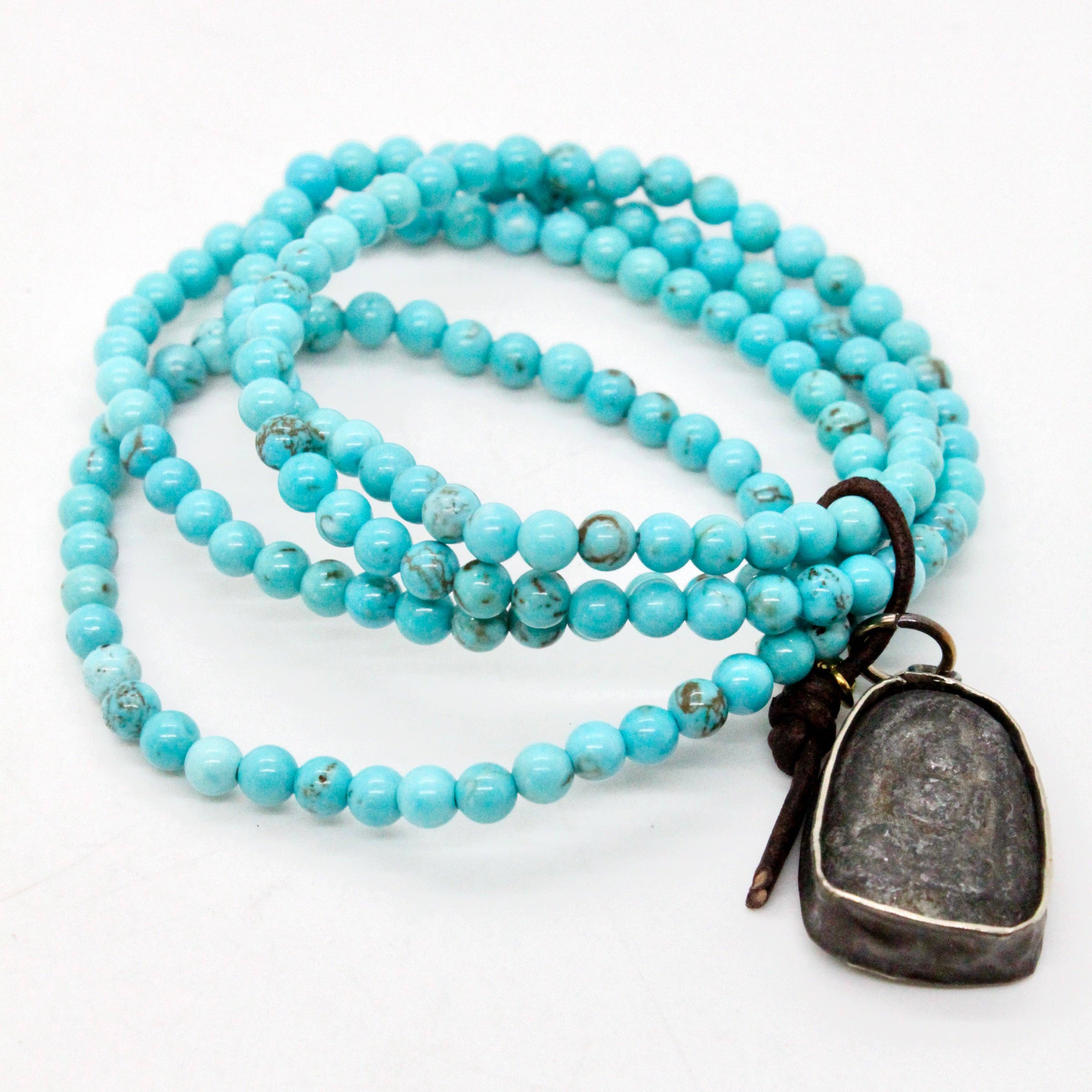 Turquoise and Small Buddha Charm Bracelet -Buddha Collection- with vibrant blue beads and rustic Buddha charm detail