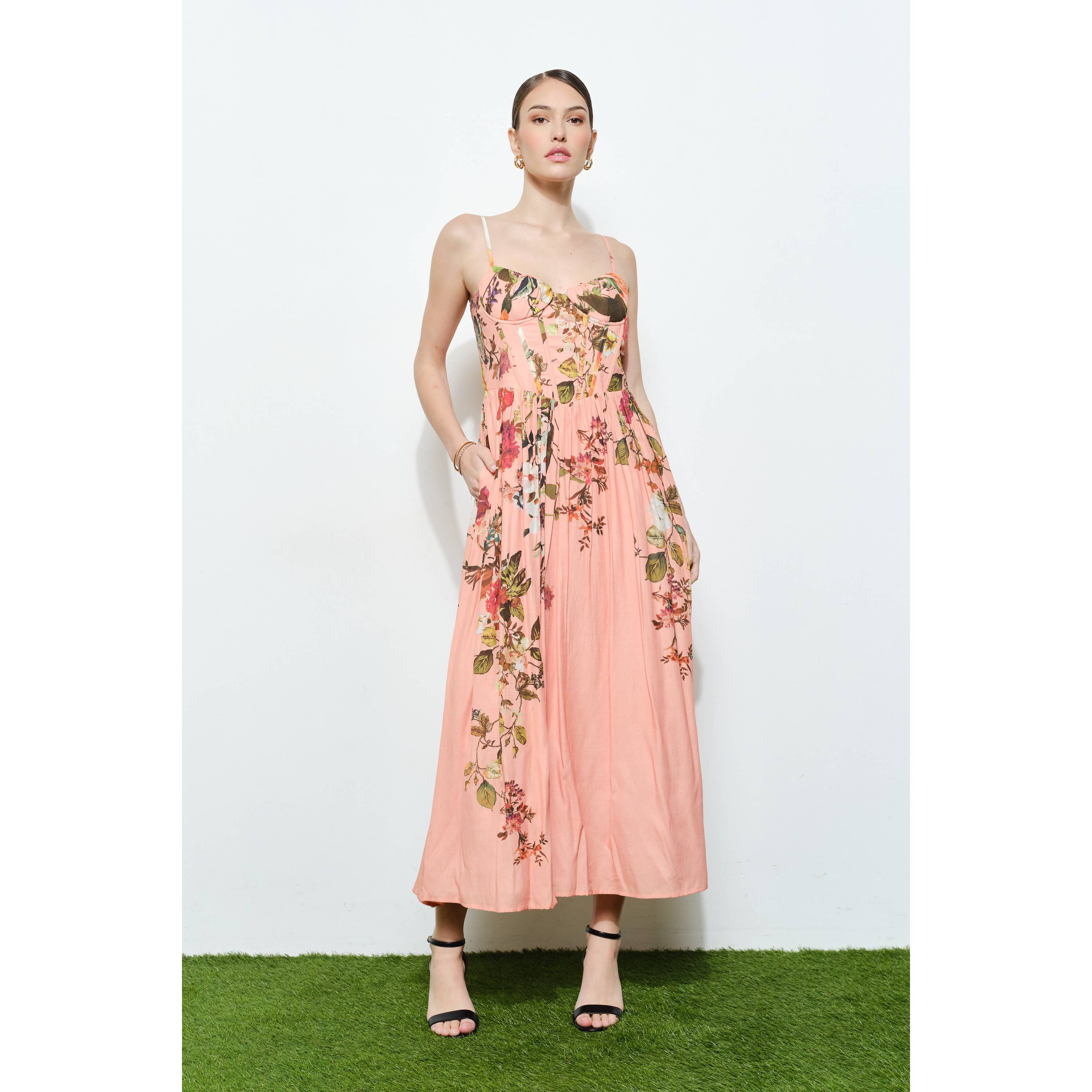 Model wearing a Vintage Floral Sweetheart Maxi Dress with delicate floral print and slim straps against white background