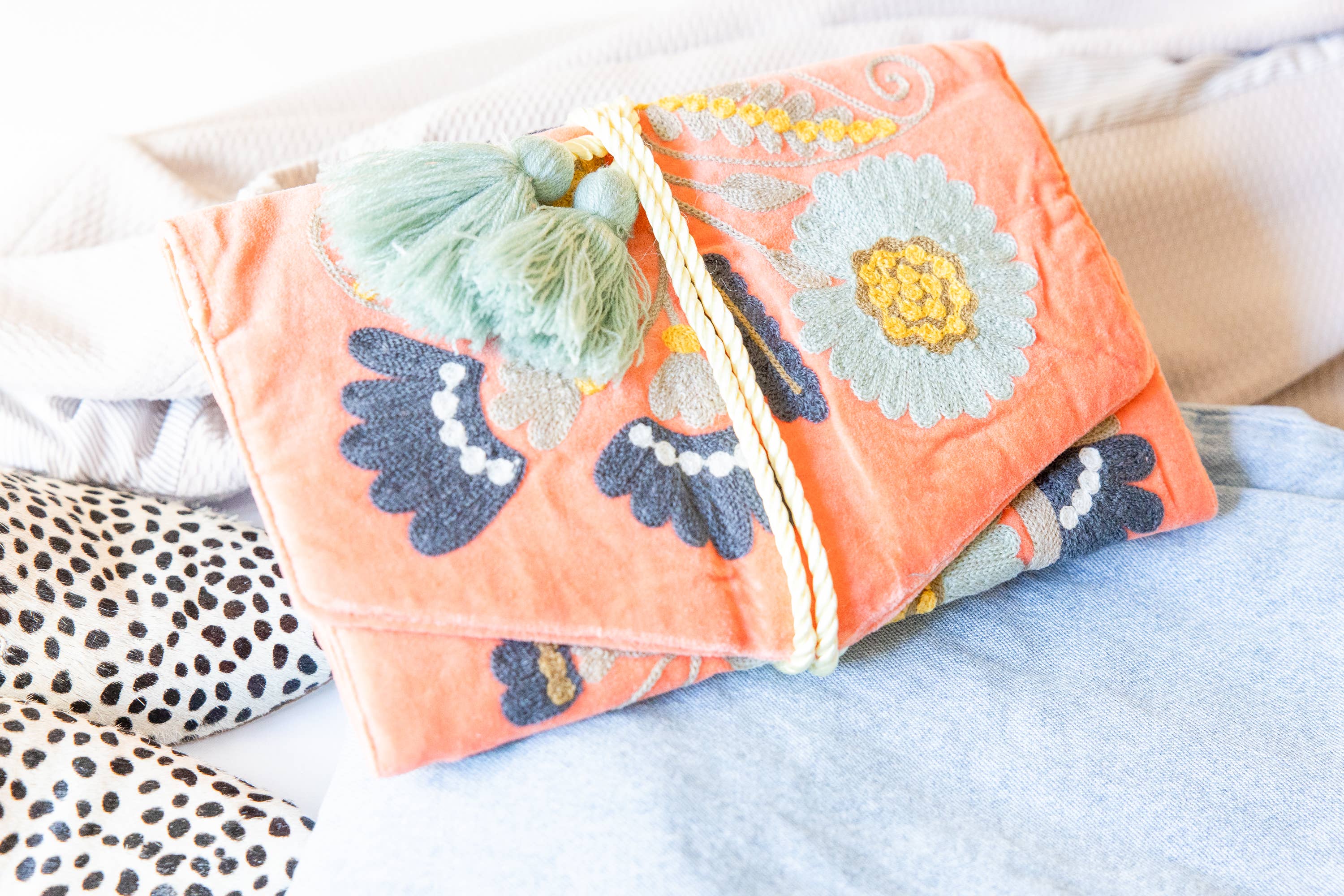 Embroidered Velvet Jewelry Organizer-Coral with intricate floral embroidery and soft tassel detail for stylish storage.