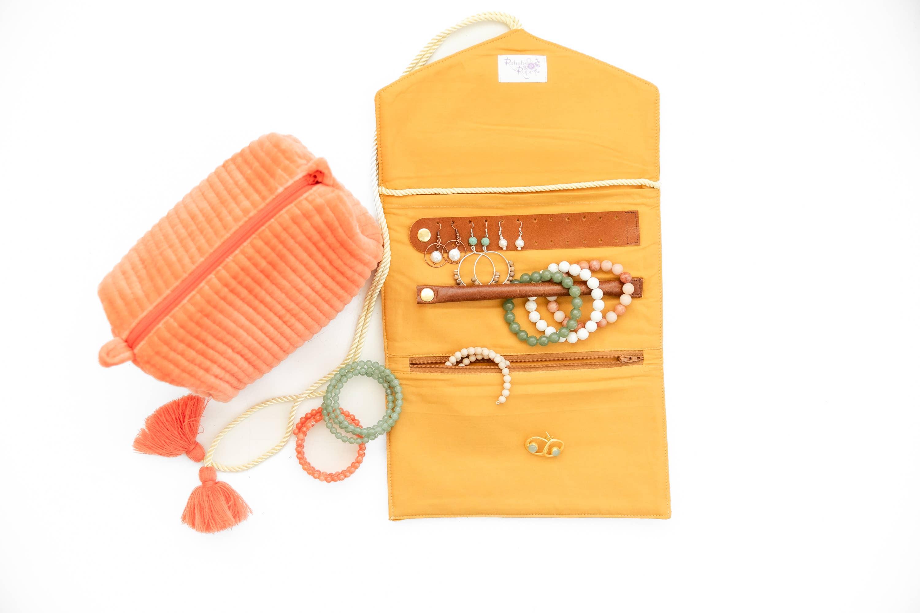 Embroidered Velvet Jewelry Organizer-Mustard open with bracelets, rings, and earrings displayed alongside a peach velvet pouch.