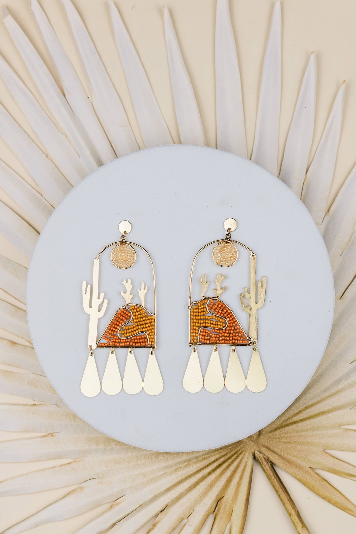 Sonora Sunrise beaded cactus earrings with orange accents and cream fringe dangling details