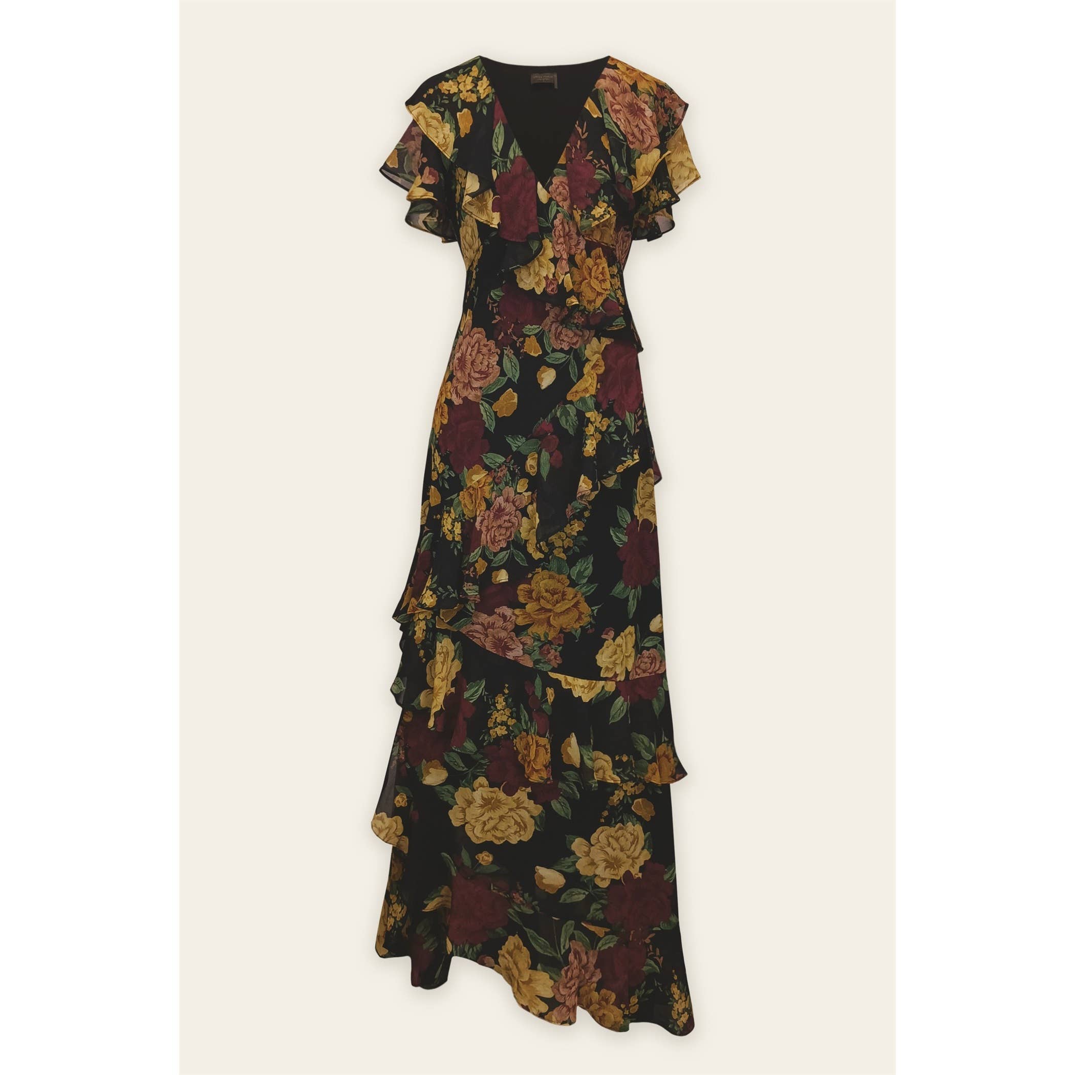 The Twilight Bloom Ruffled V Neck Maxi Dress by Dress Forum features a black base with vibrant yellow, maroon, and green floral prints, short ruffled sleeves, a V-neckline, and a tiered skirt with elegant ruffle details.