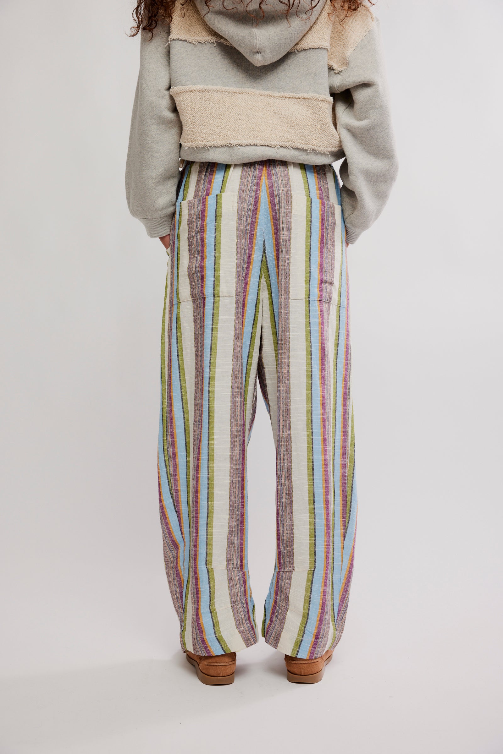 Back view of Free People Chambers Laid Back Stripe Pull-On Pant with multicolor vertical stripes on relaxed fit fabric
