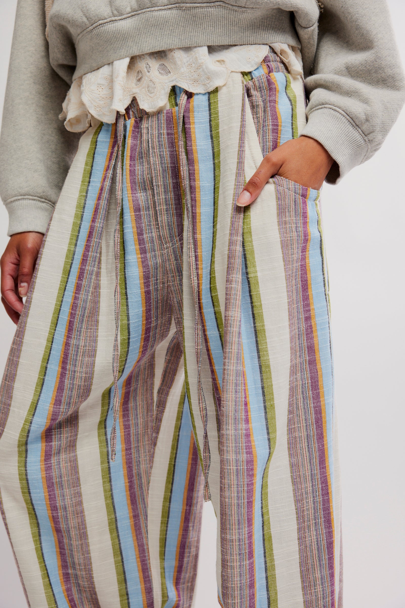 Close-up of relaxed fit colorful striped fabric in Free People Chambers Laid Back Stripe Pull-On Pant pocket detail