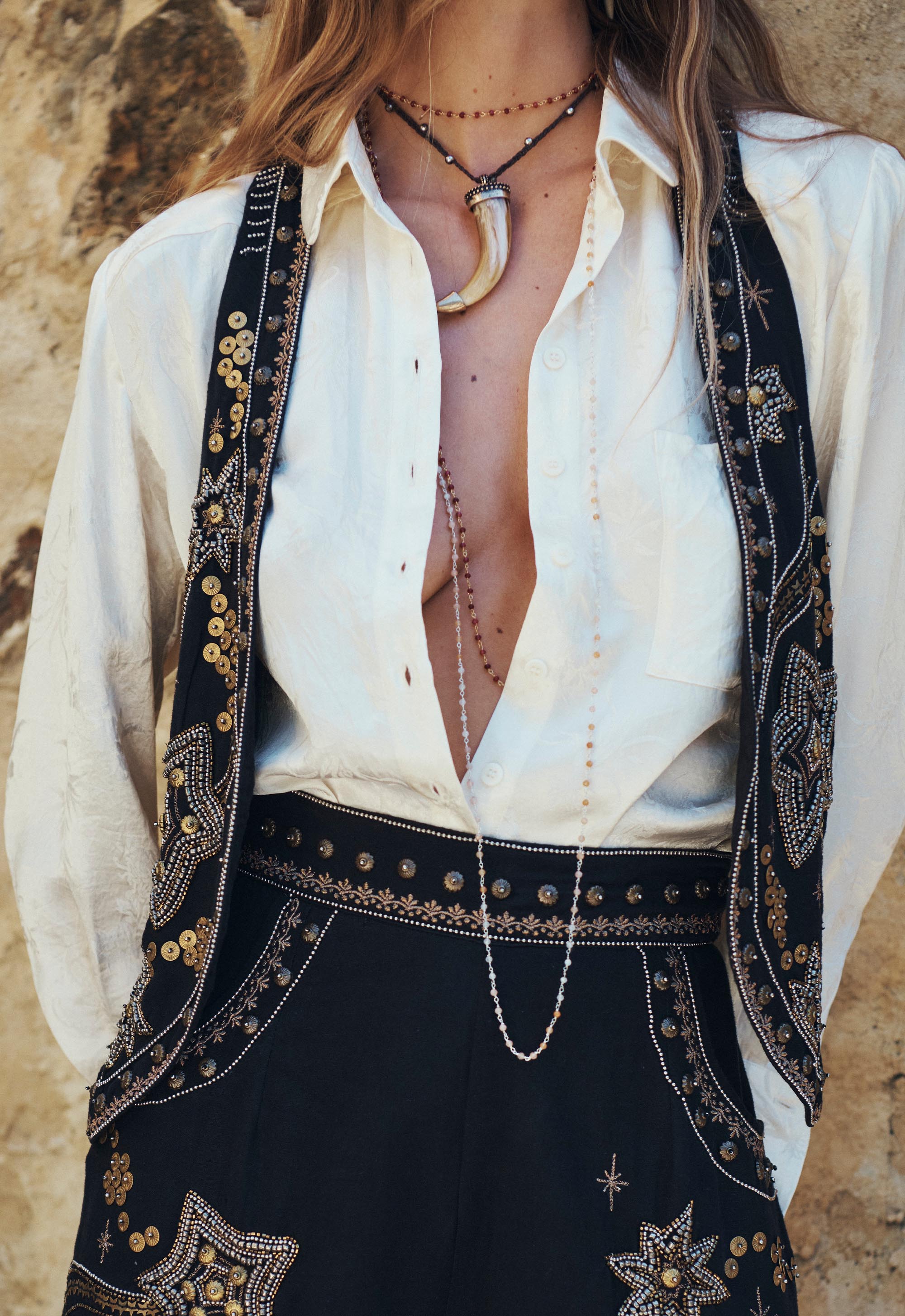 Spell Night Sky Vest – Midnight with intricate gold embroidery worn over an open white shirt paired with matching black skirt