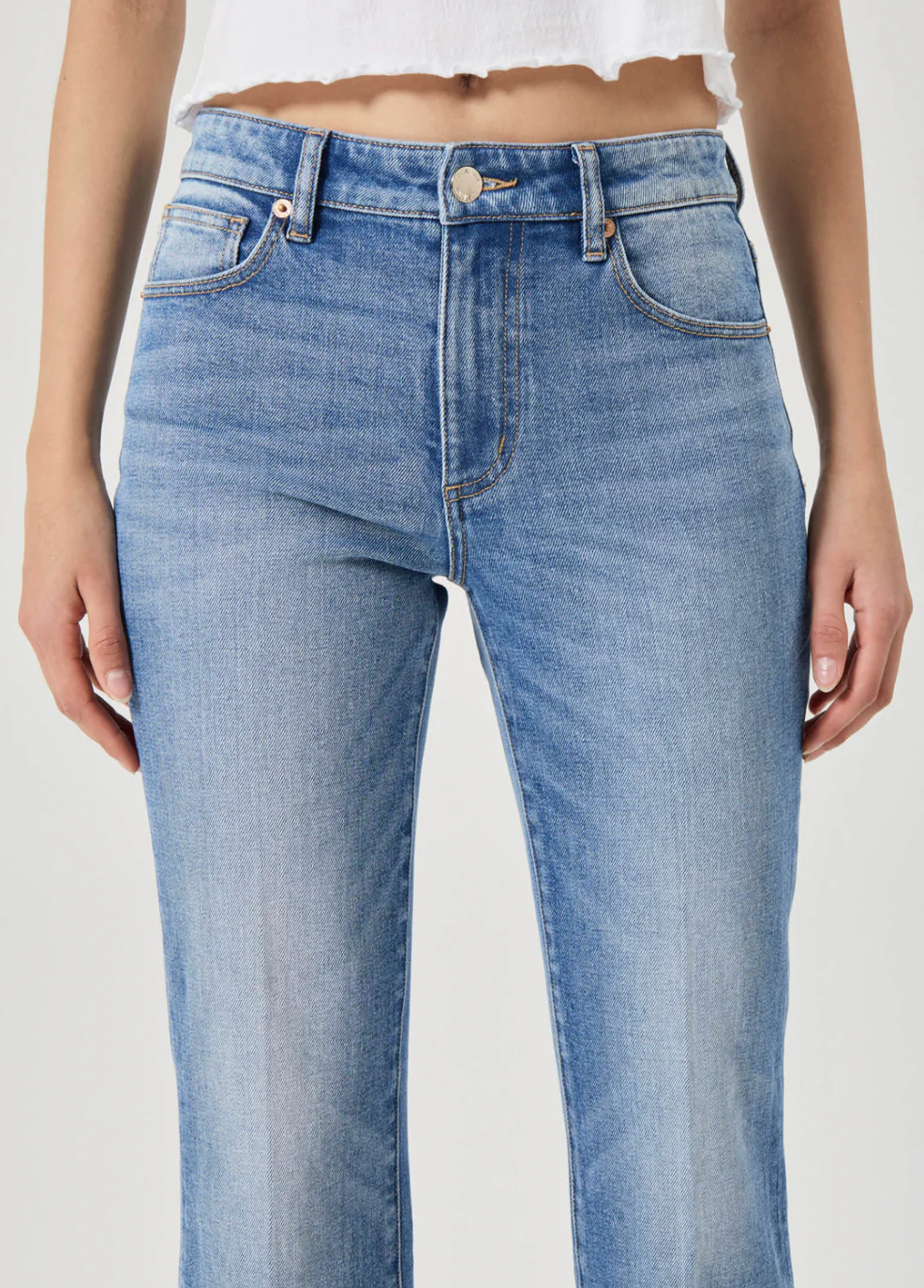 Rolla's Midtown Boot in Blue Iris shown on model wearing a cropped white top with mid-rise blue denim jeans