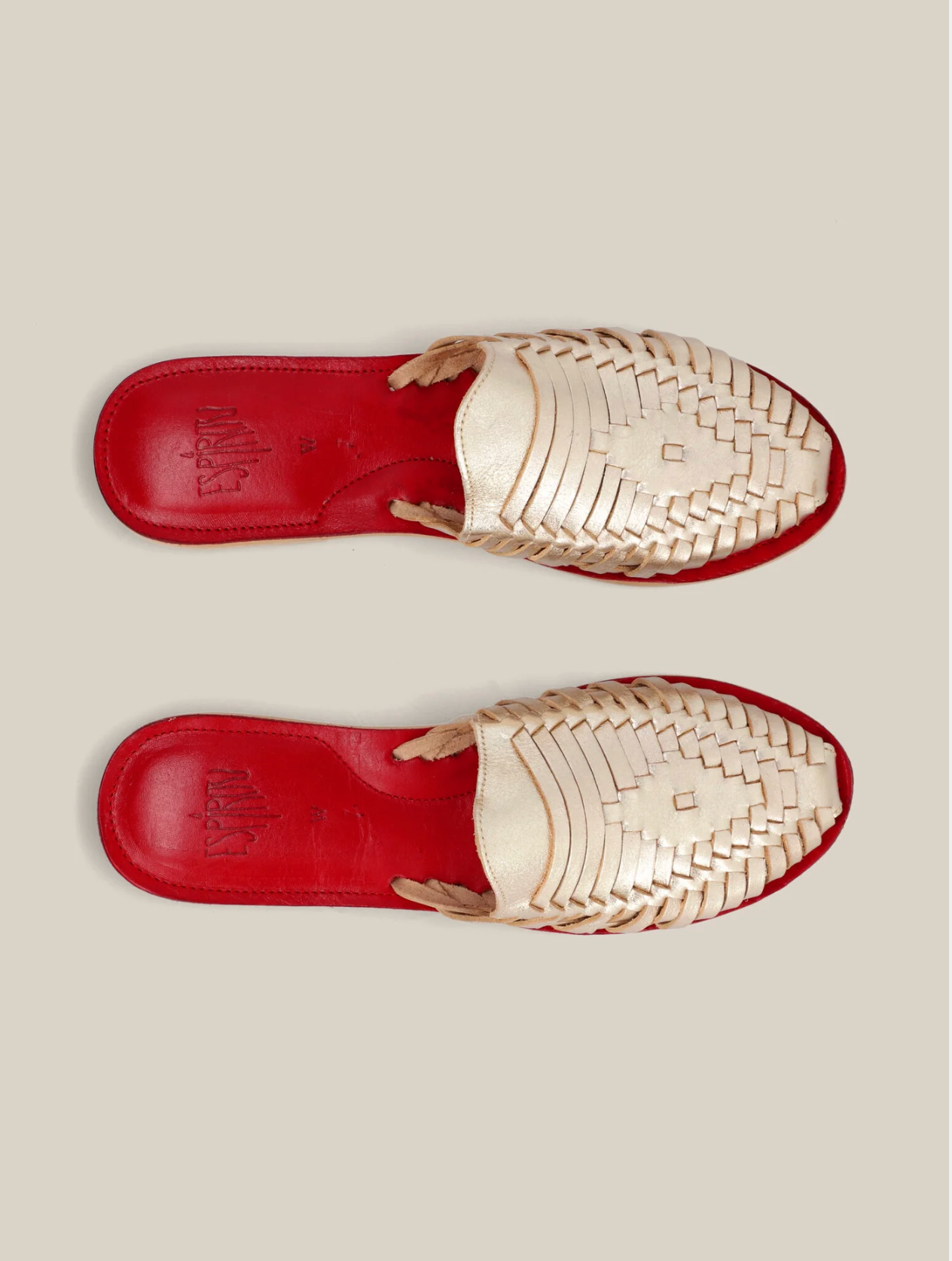 Gold Slip On Huarache Sandal with intricate woven design and contrasting red cushioned sole for stylish comfort