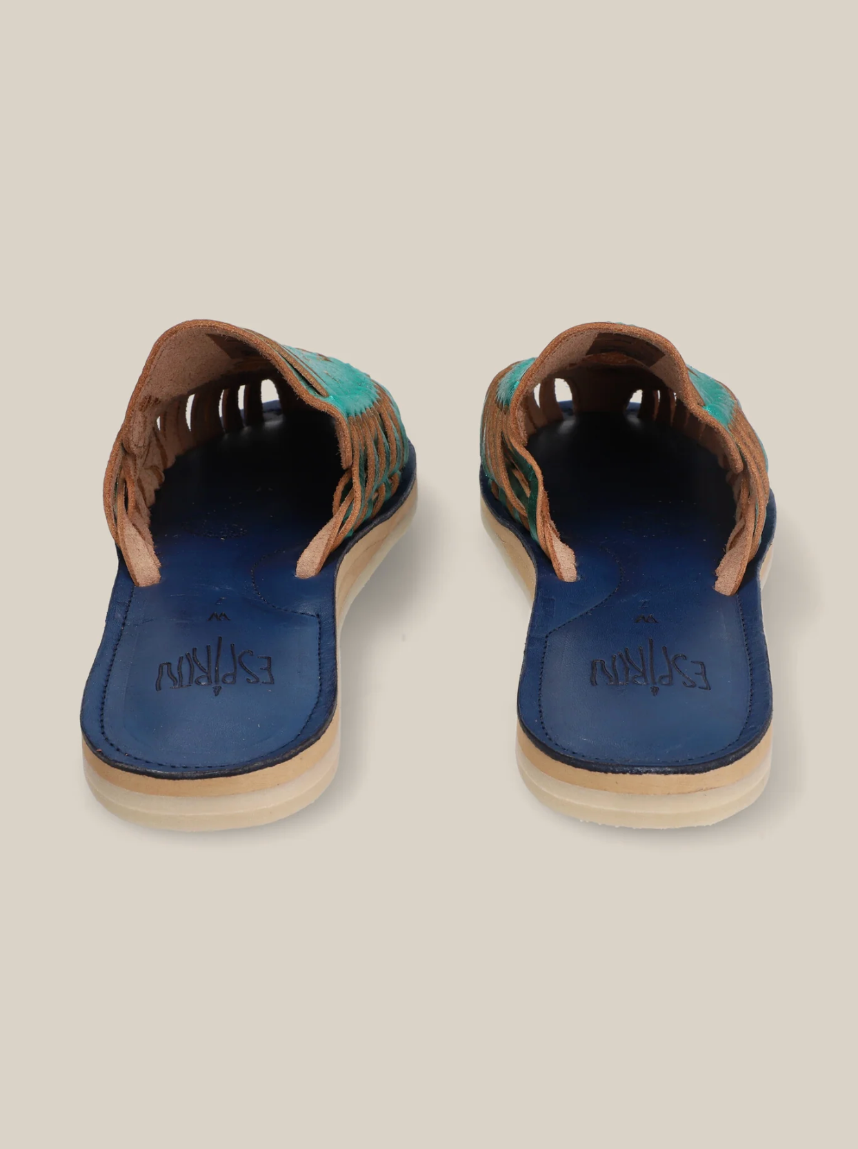 Emerald Slip On Huaraches with blue footbed, tan leather straps, and green woven accents for casual wear.