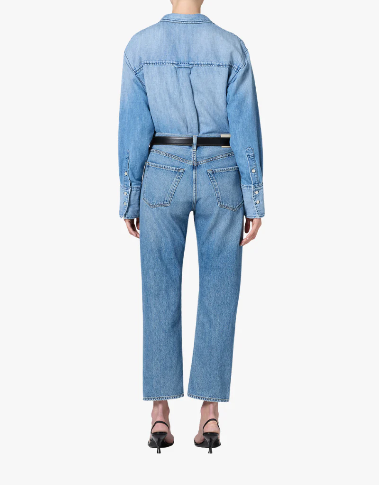 Rear view of a woman wearing Citizens of Humanity Winslow Jean in Solstice with a matching denim shirt and black heels