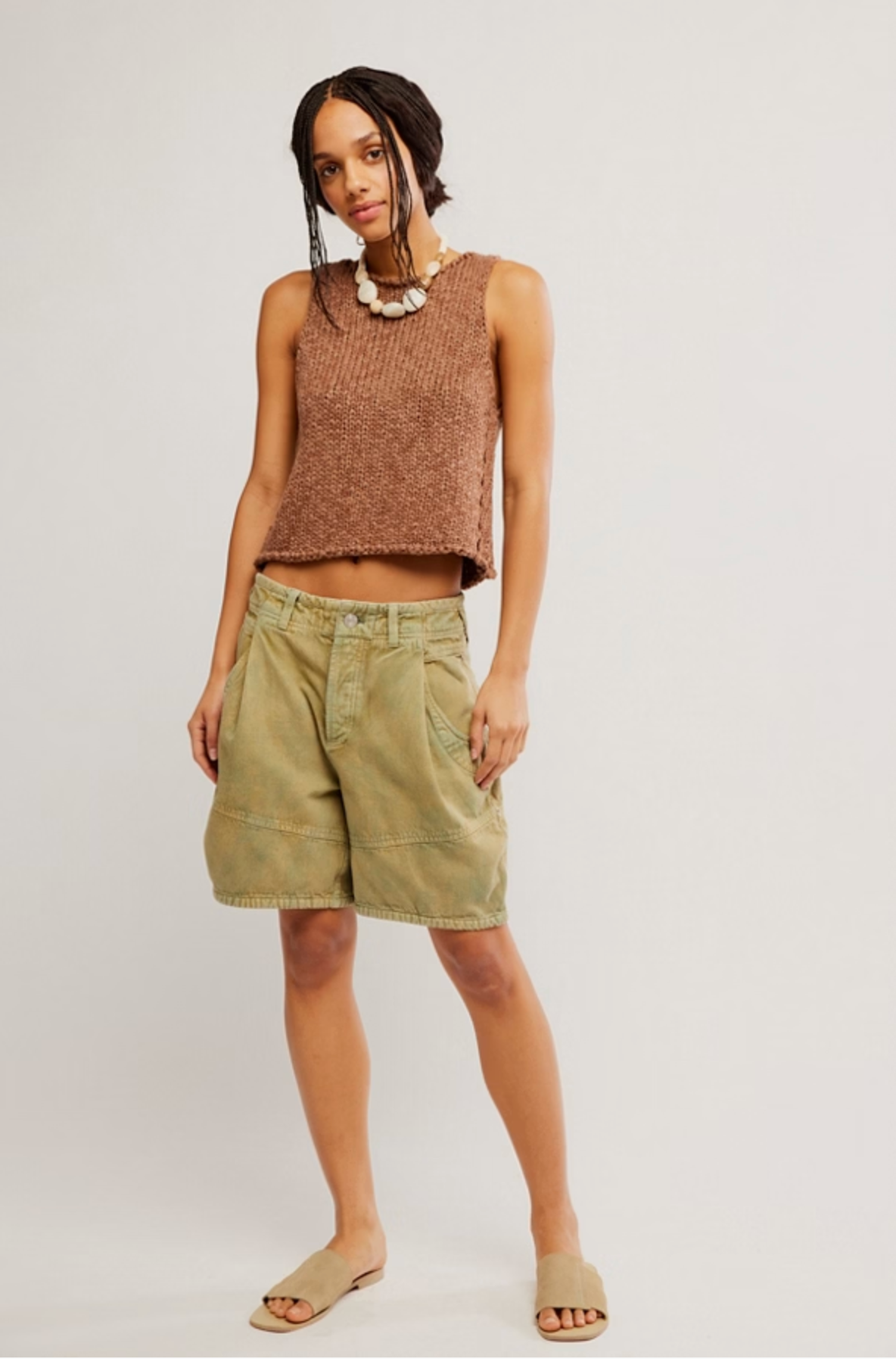 Woman wearing Wild Rebel Short in Outlaw Taupe with a knitted brown sleeveless top and beige sandals