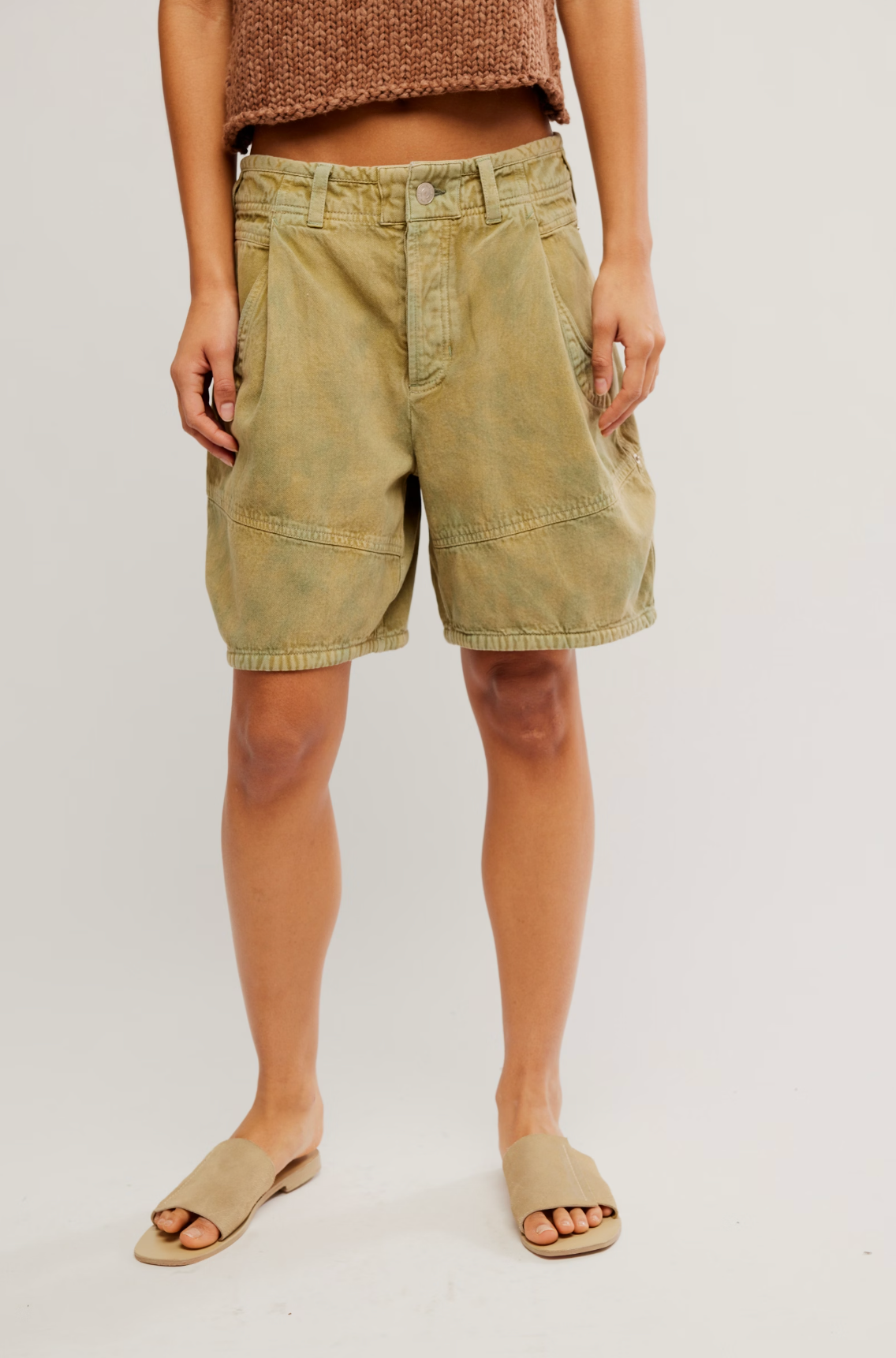 Front view of a person wearing Wild Rebel Short in Outlaw Taupe with a cropped knitted top and slip-on sandals.