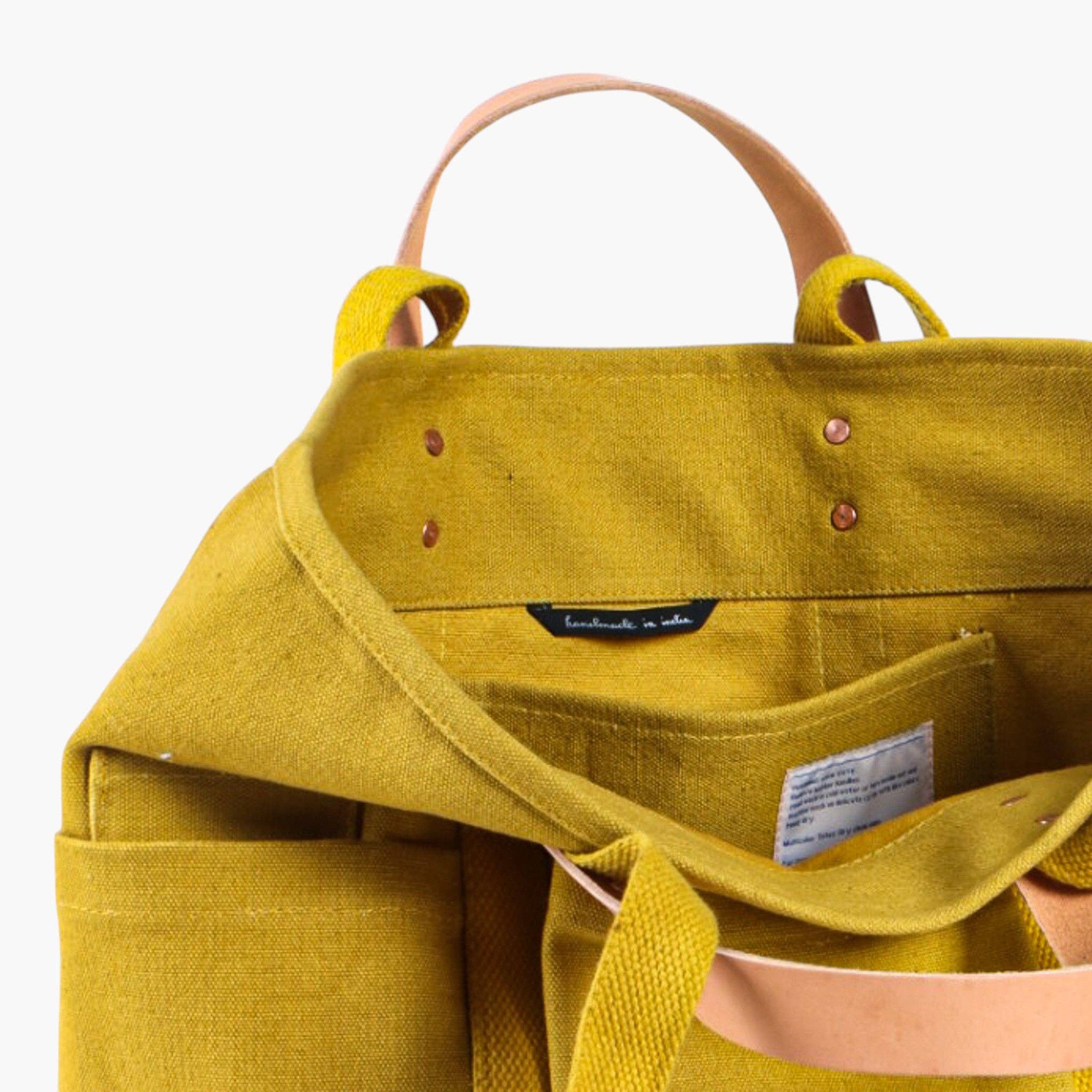 Open Construction Tote | Chartreuse showing soft canvas texture and natural leather handles with spacious interior pockets