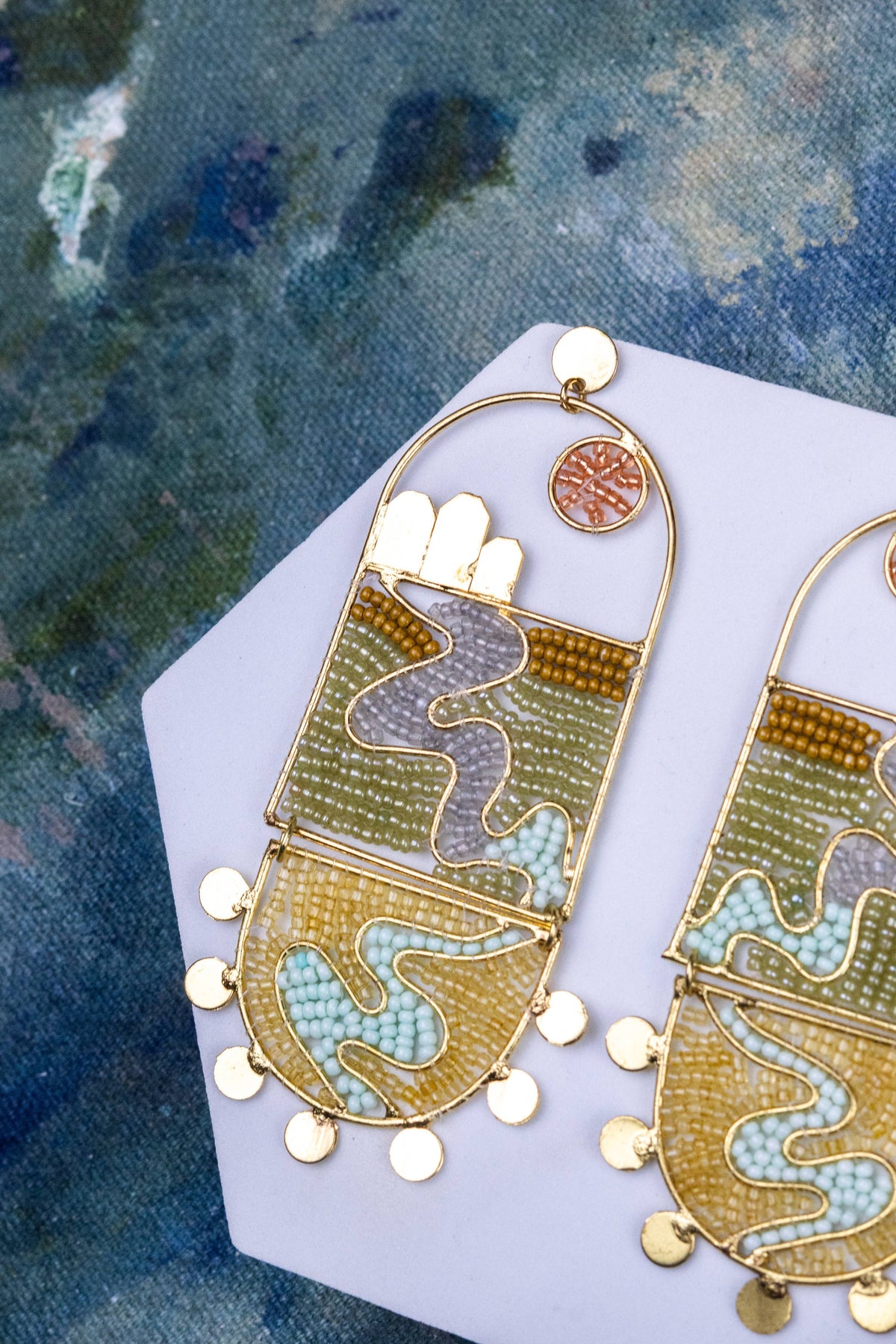 The River Flows Yonder artful earrings with gold tone arches and blue green beadwork