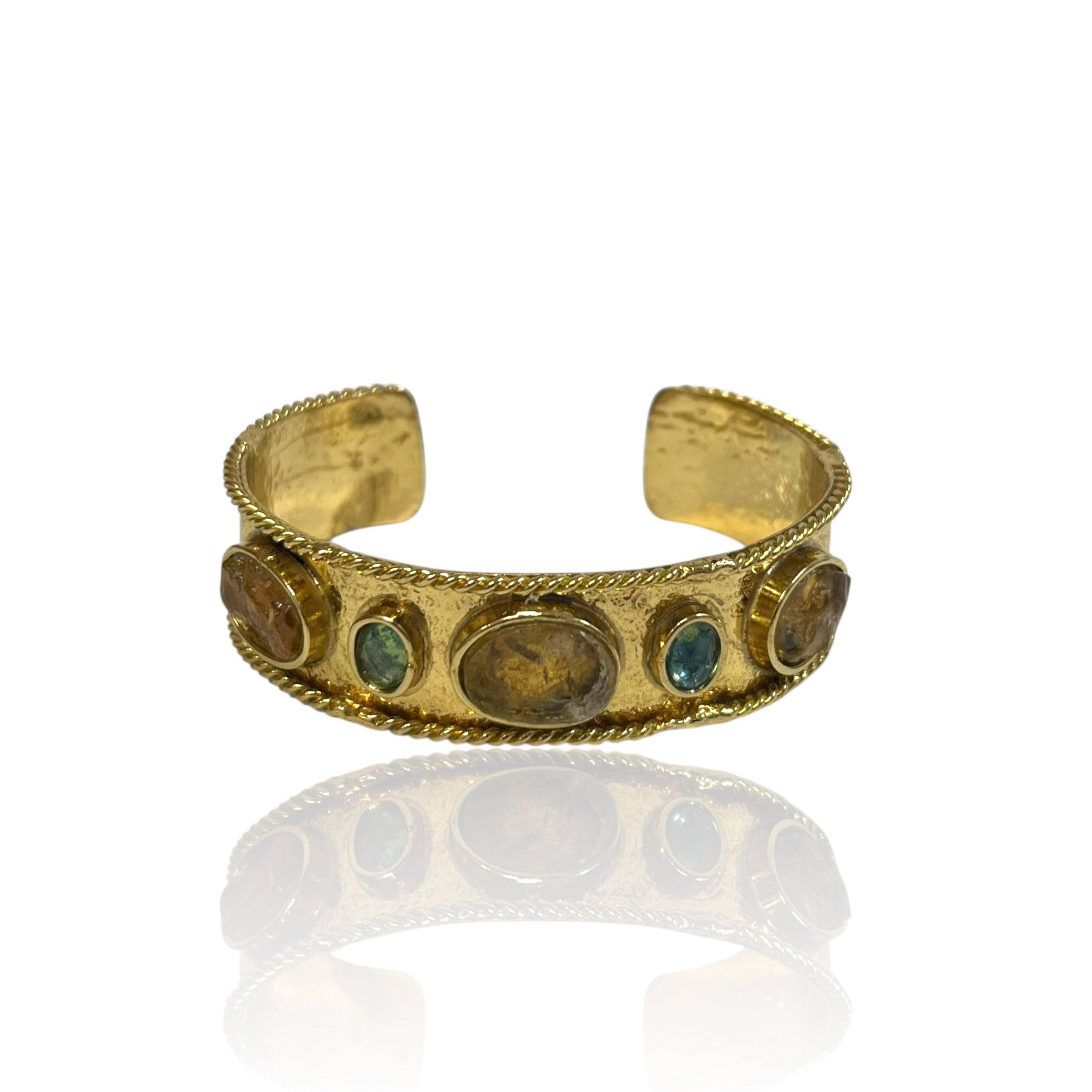 Smoky Quartz Gem Cuff featuring polished smoky quartz and blue gemstones set in a gold-tone artisan band