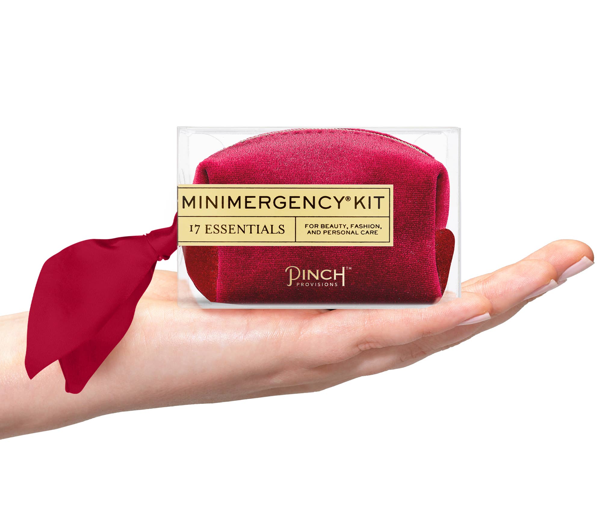 Velvet Scarf Minimergency Kit displayed on hand, compact red pouch with silk scarf tied on side, travel essentials set