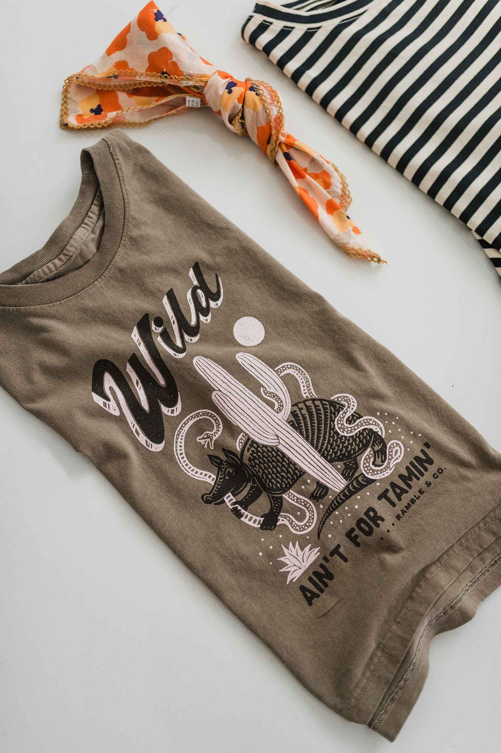 Wild ain't for tamin' desert | faded brown boxy muscle tee
