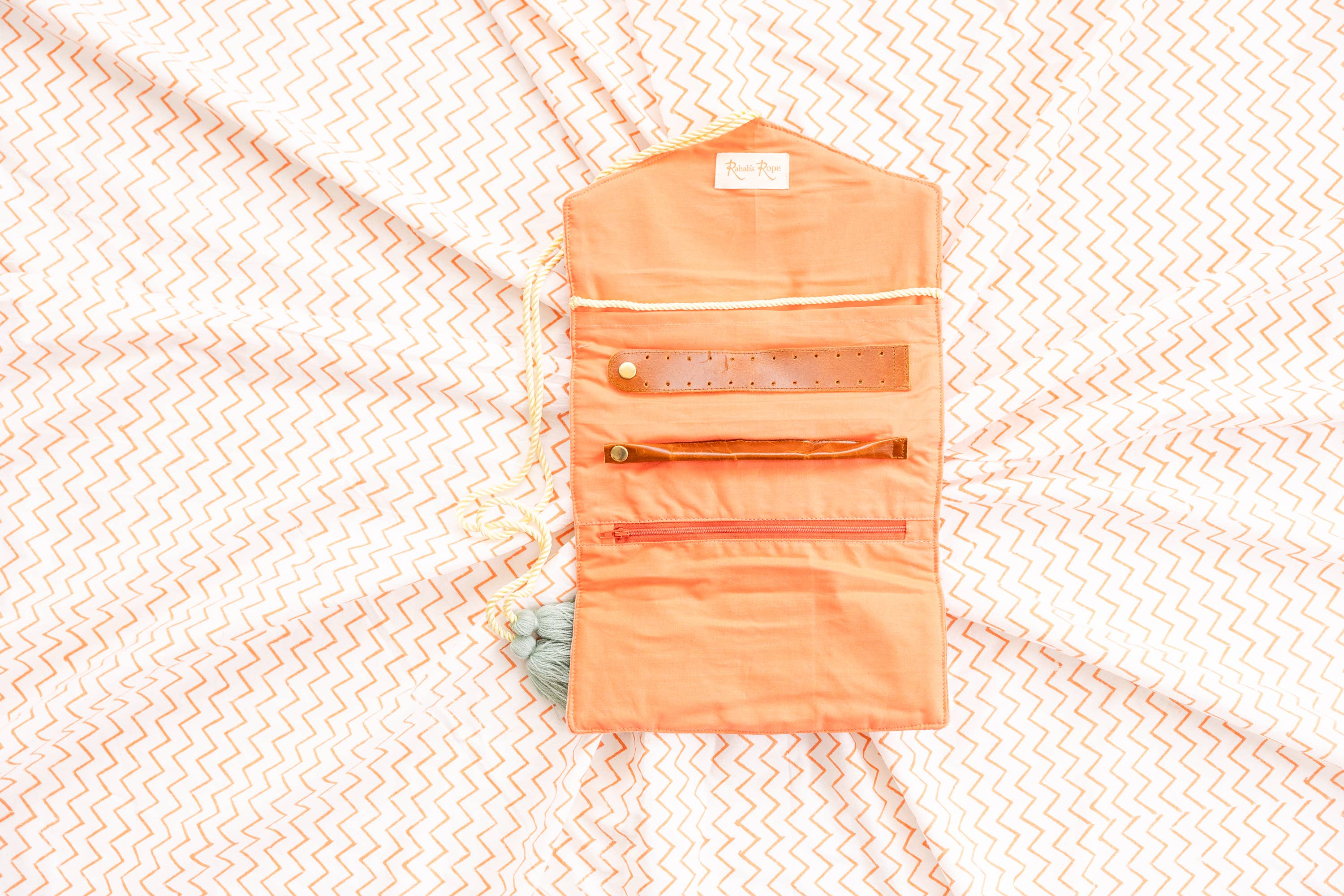 Embroidered Velvet Jewelry Organizer-Coral open with compartments on patterned fabric background for stylish storage