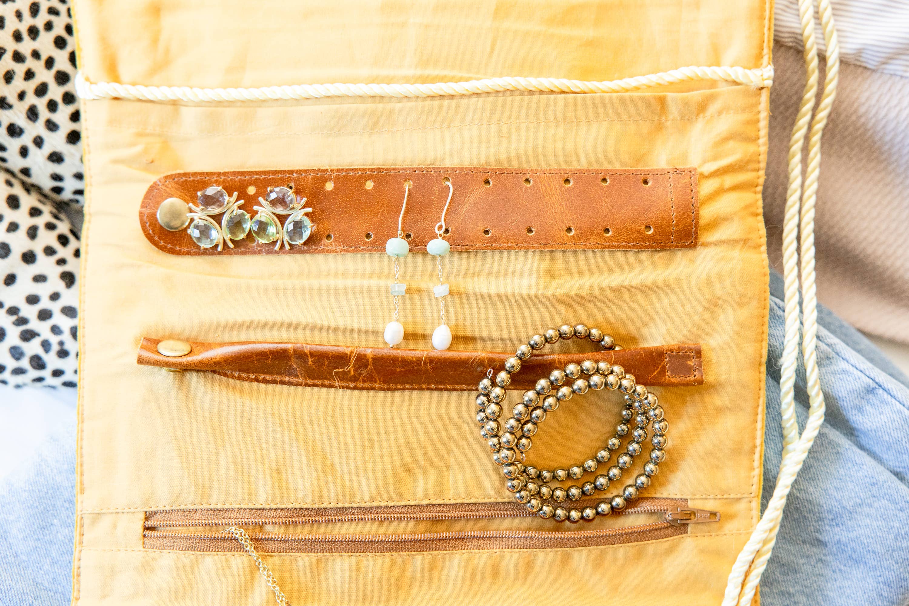 Embroidered Velvet Jewelry Organizer-Mustard with gold bracelets and earrings on soft mustard velvet fabric organizer
