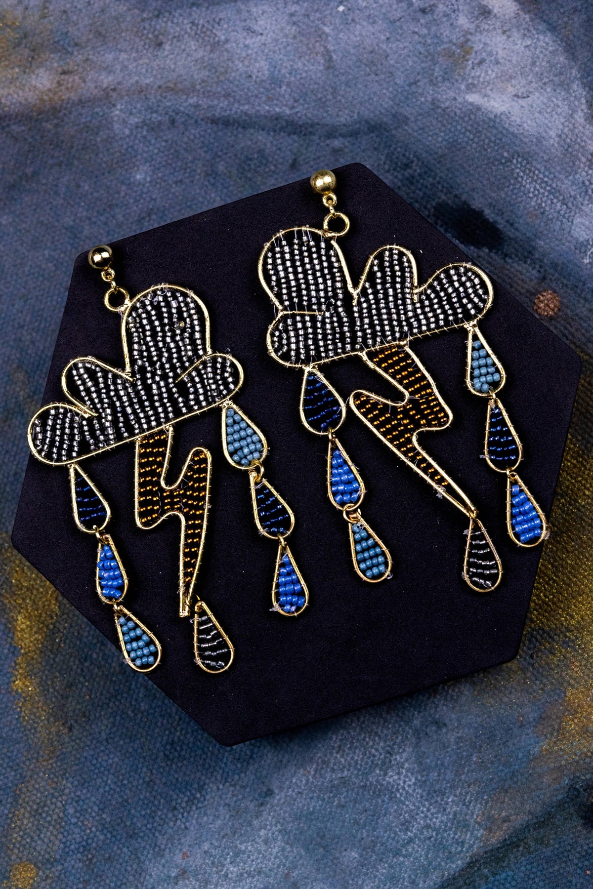 Storms a Brewin Danglers gold tone beaded cloud and lightning earrings with colorful raindrops
