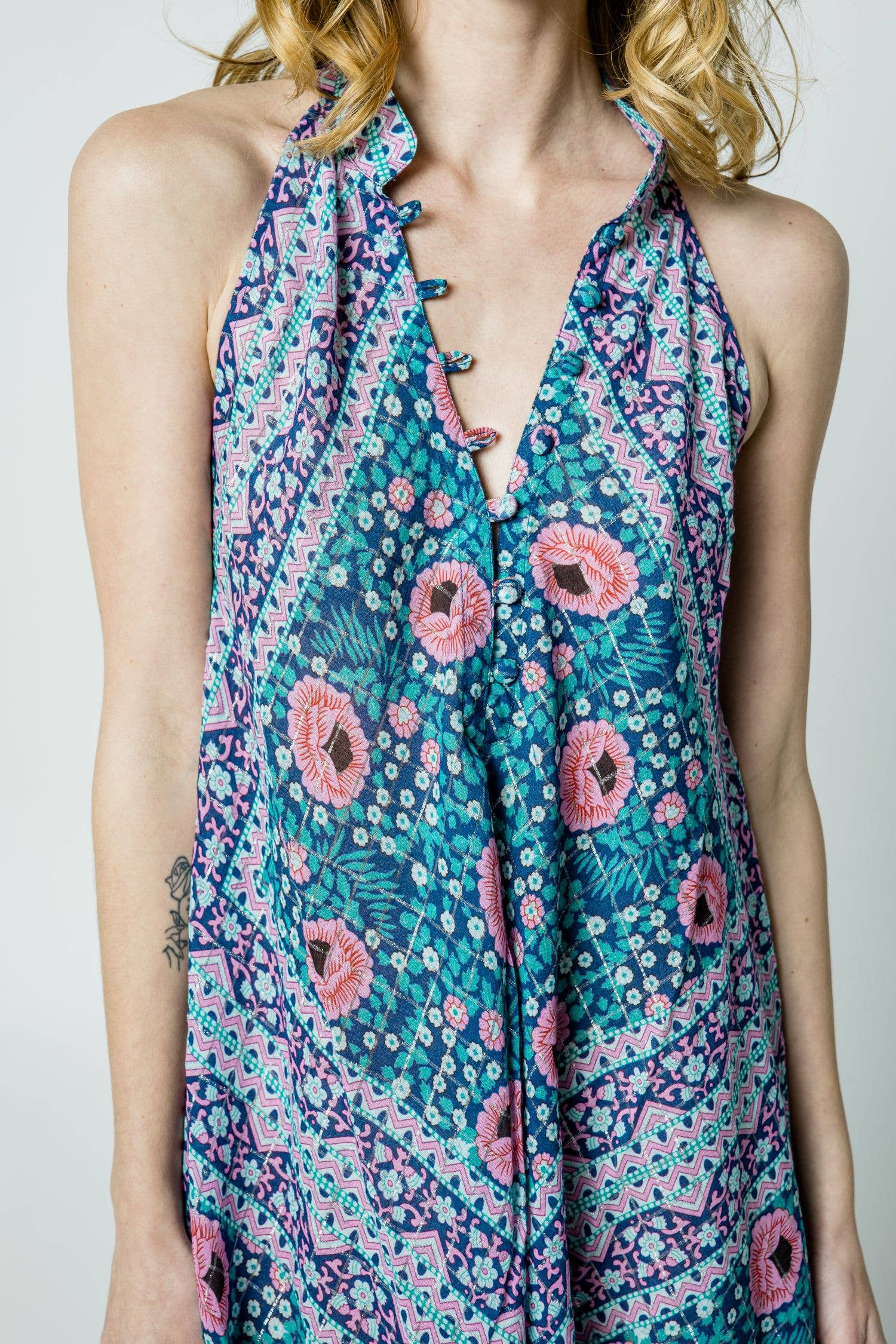 Woman wearing Cotton Glendora Maxi Dress with vibrant floral and geometric patterns in blue, pink, and green tones