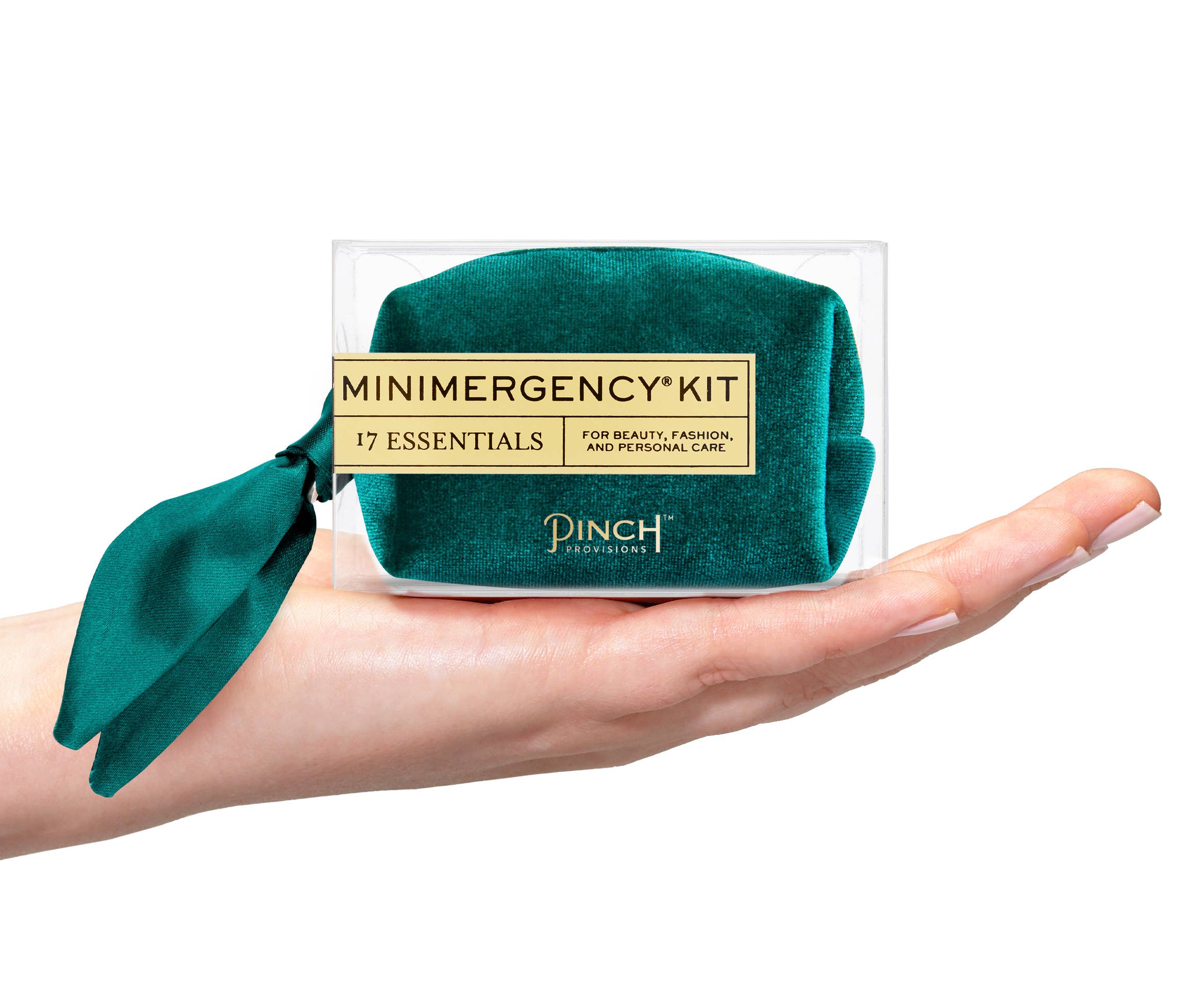 Velvet Scarf Minimergency Kit held in hand featuring a teal velvet pouch with ribbon detail and label on front