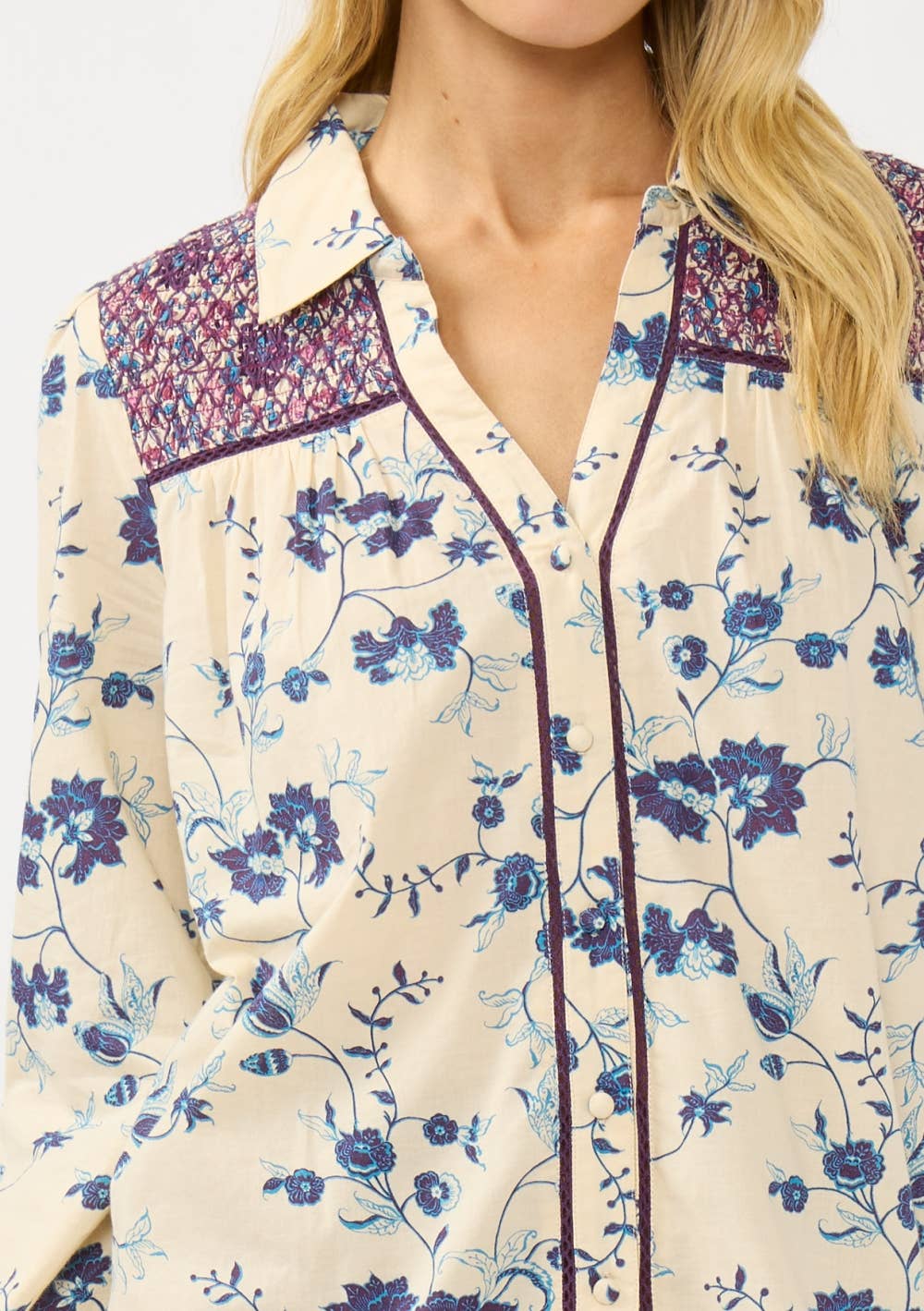 Close-up of Long Sleeve Floral Blouse with Smocked Yoke featuring blue and purple floral patterns on cream fabric