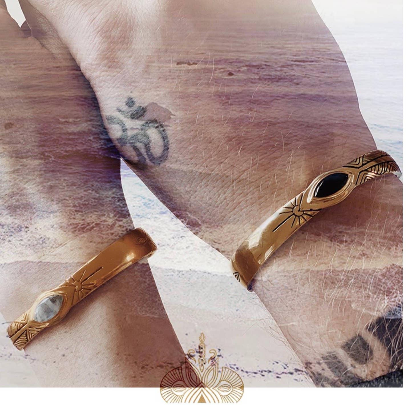 Three Rivers Cuff in brass with black stone and etched sunburst design on wrist with ocean background.