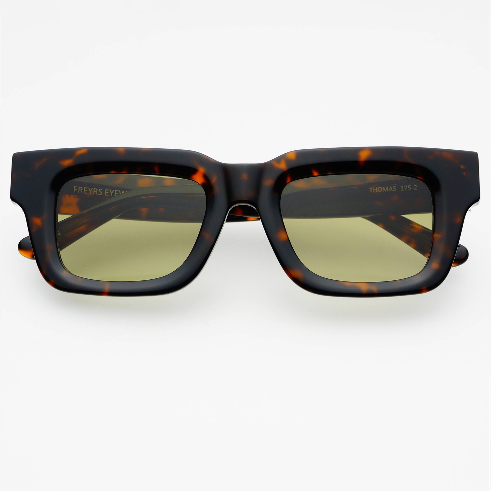 The Thomas Acetate Unisex Rectangular Sunglasses by FREYRS Eyewear feature thick handmade acetate frames in tortoiseshell and green-tinted nylon lenses with UV protection, shown on a plain white background.