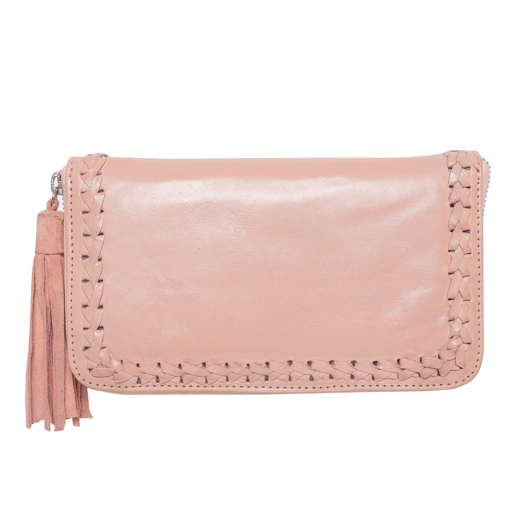 The Jodi Lee Queen Hummingbird Wallet Blush is a light pink bohemian clutch with braided trim and a tassel zipper pull, displayed against a white background.