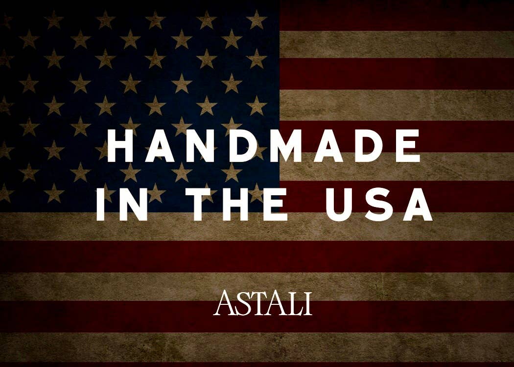 Handmade in the USA over a faded American flag background, featuring ASTALI—an ideal backdrop to display your Vintage Pocket Knife & Coyote Tooth Necklace – Pyrite & Deerskin Leather.