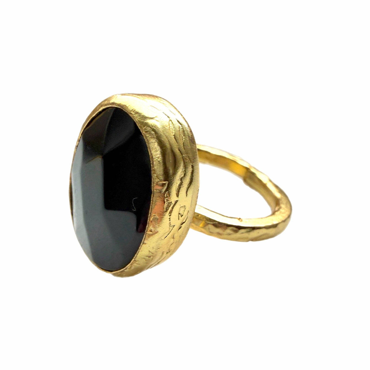 Oval Gold and Onyx Ring (Small) featuring a black oval stone and textured gold band