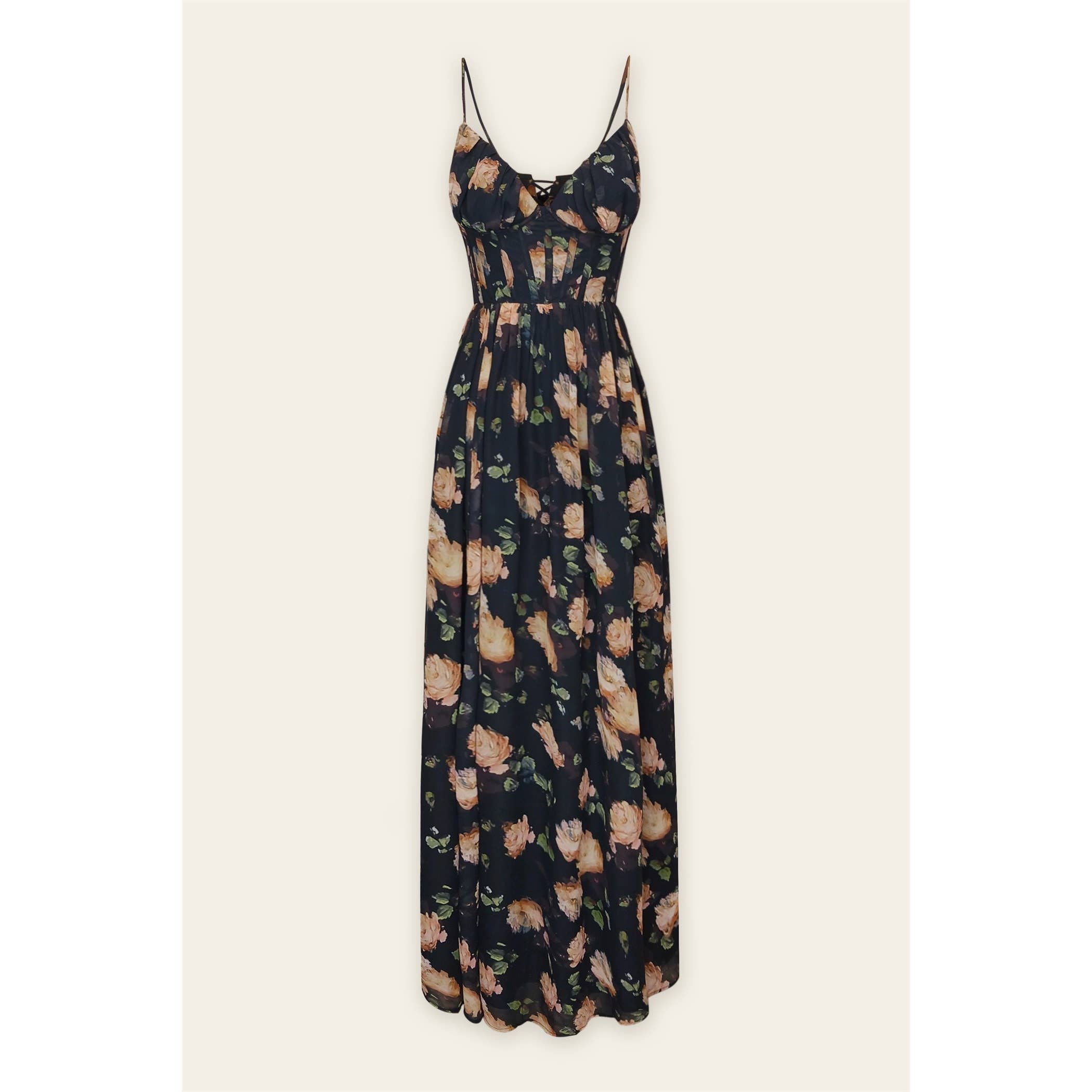 The Opaline Shadow Corset Maxi Dress by Dress Forum is a sleeveless, floor-length chiffon dress with thin spaghetti straps and a peach and green floral print, featuring a flowy skirt, shown on a plain background.
