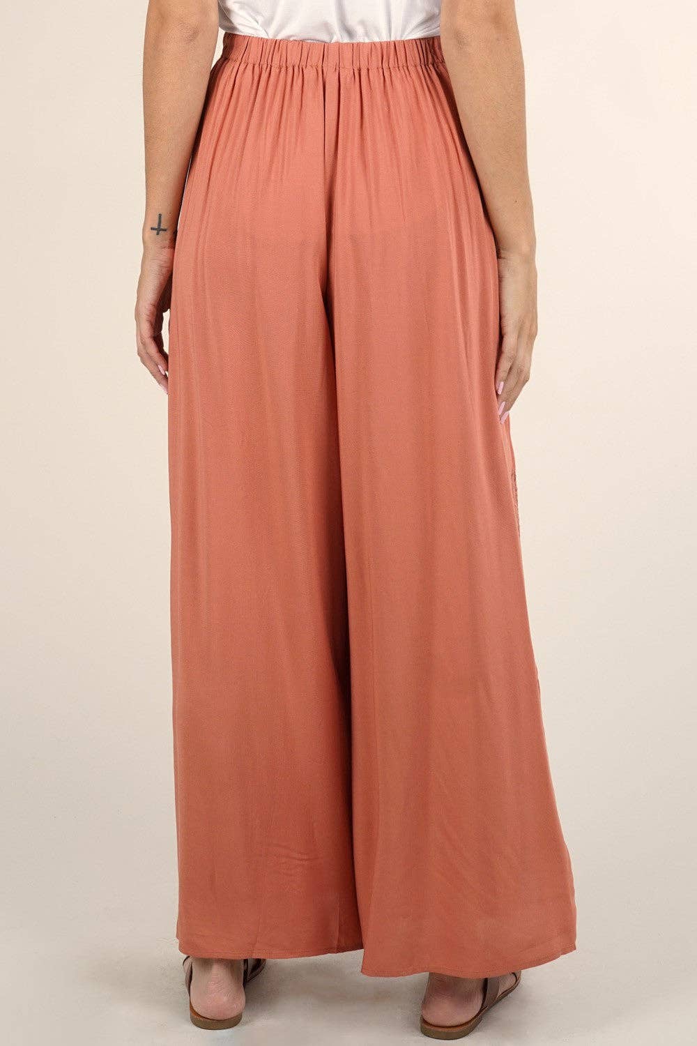 Back view of Boho Beach Light Weight Wrap Pant in soft terracotta fabric with elastic waistband and wide legs.