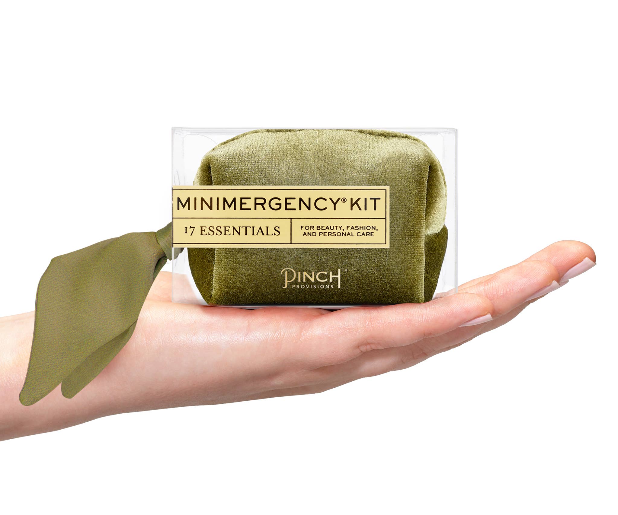 Velvet Scarf Minimergency Kit in olive green held in hand, compact pouch with essential beauty and personal care items