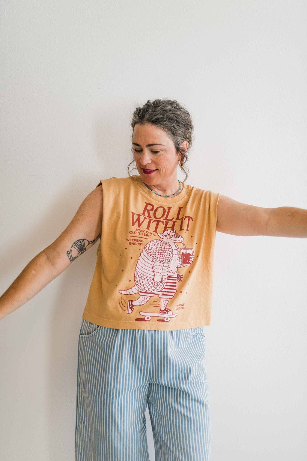 Roll with it armadillo | faded mustard boxy muscle tee