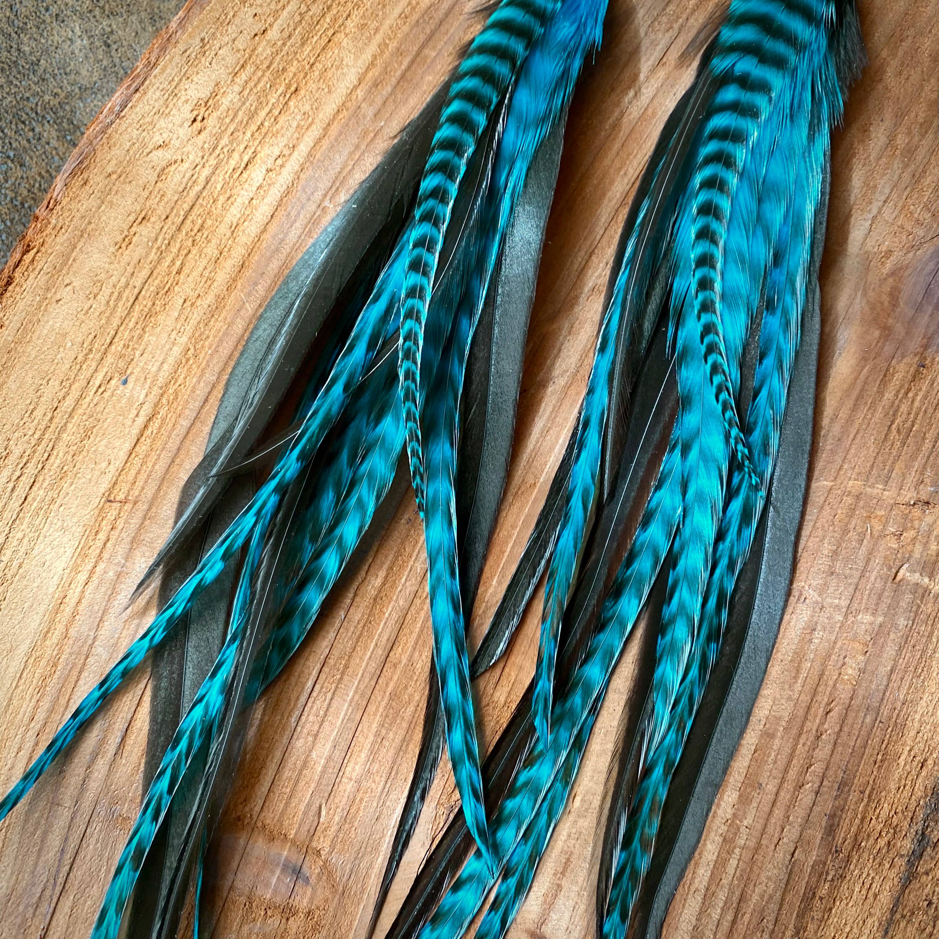 ASTALIs Long Feather & Cone Earrings feature turquoise grizzly and black/gold sustainably sourced feathers with natural, textured patterns—perfect for crafting unique bohemian jewelry.