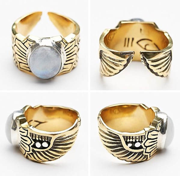 The bahgsu jewels Scarab Ring features ancient Egyptian-inspired engravings, a large round moonstone, and an open back band. Images display the ring from all angles to showcase its detailed winged design.